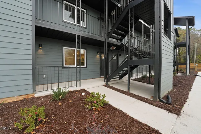 a front view of a house with garage