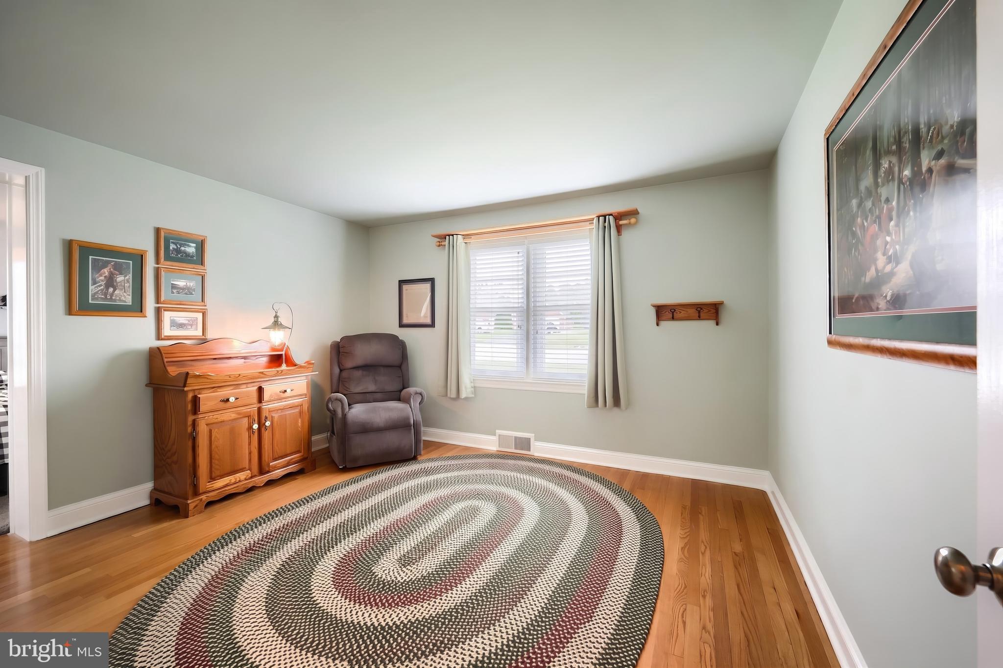 256 North Main Street Manchester, PA 17345 - Photo 14 of 38 a bedroom with a bed and wooden floor