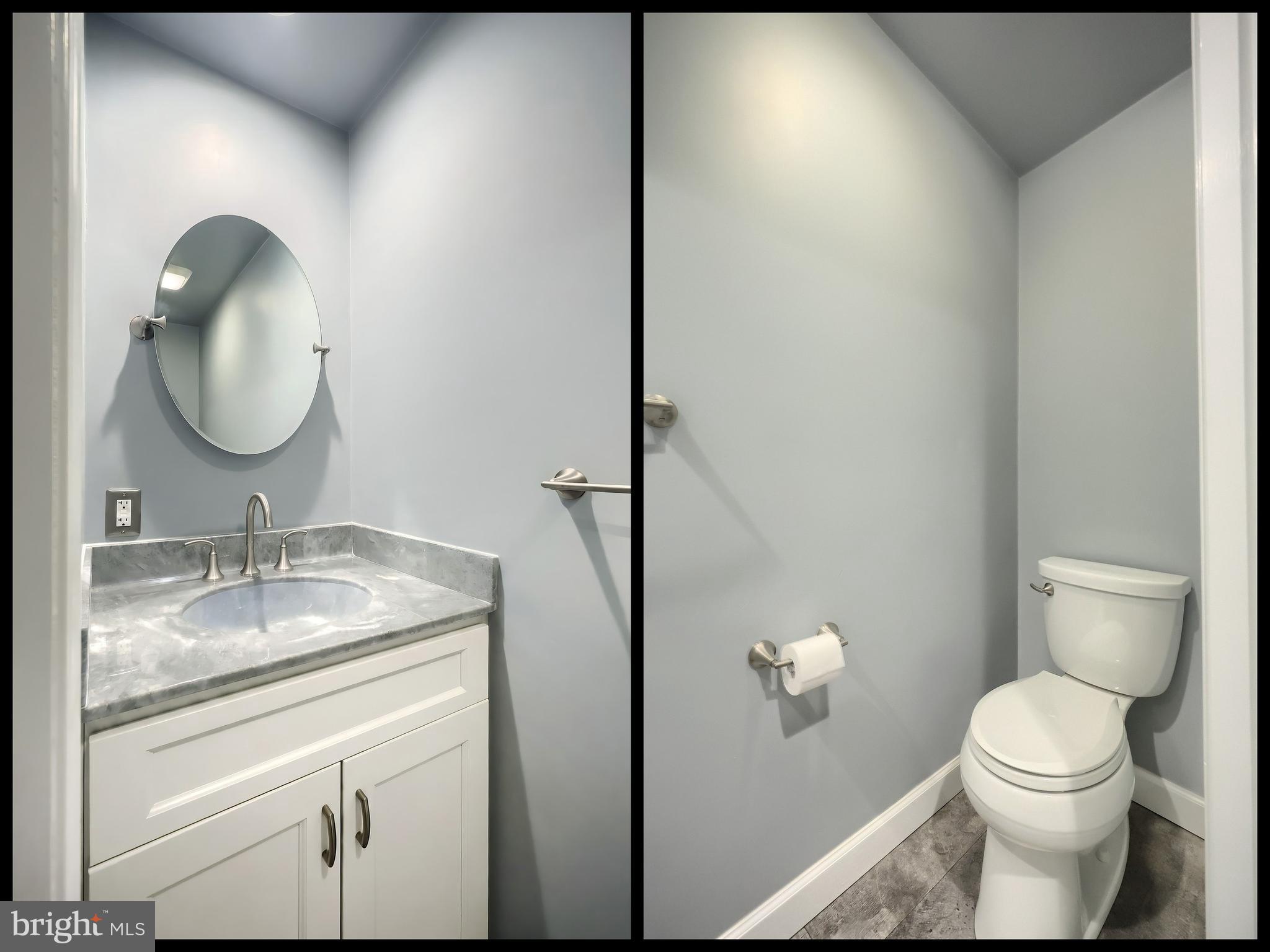 256 North Main Street Manchester, PA 17345 - Photo 18 of 38 a bathroom with a granite countertop toilet sink and mirror