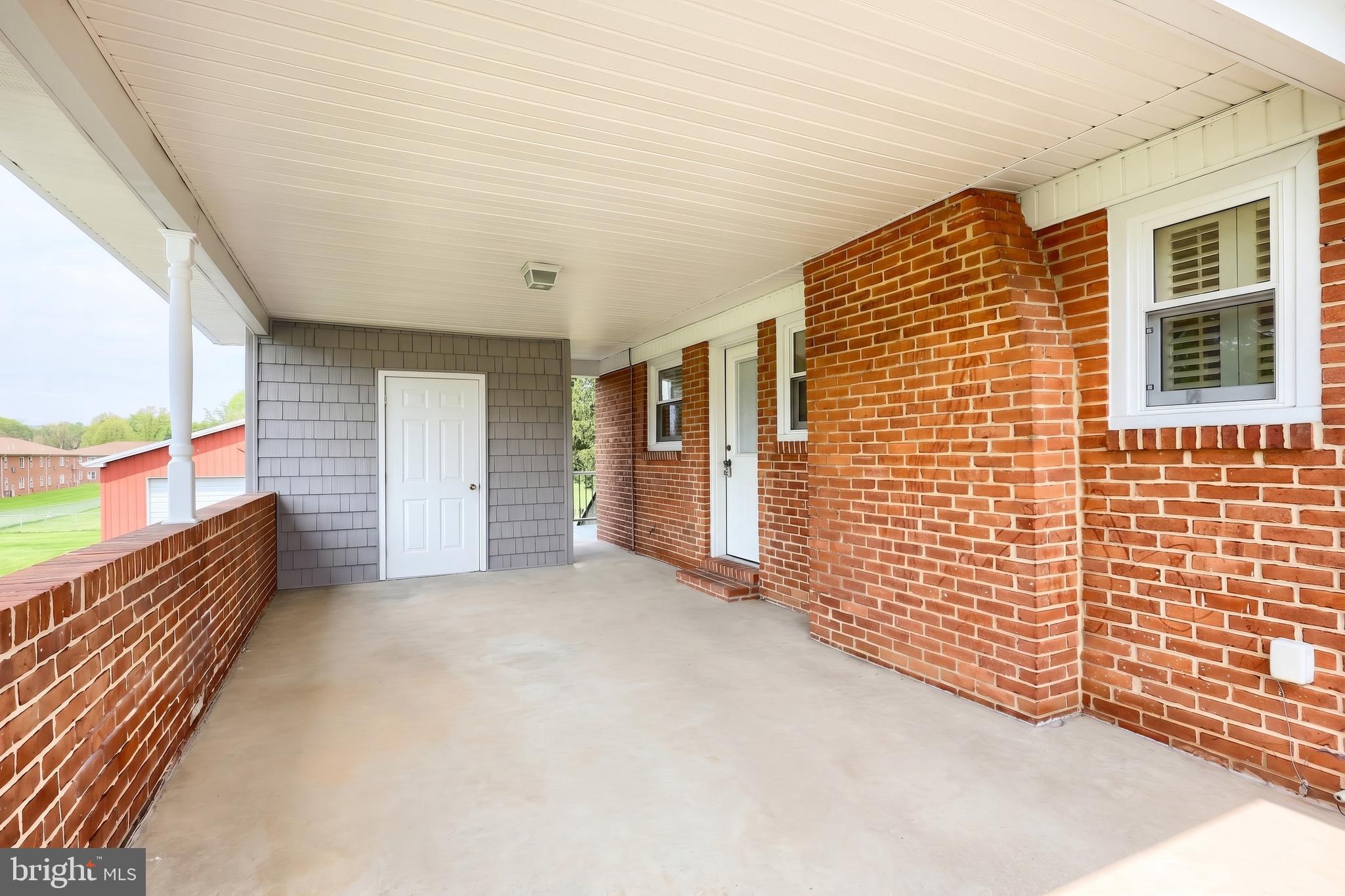256 North Main Street Manchester, PA 17345 - Photo 28 of 38 a view of an entryway with wooden floor and fence