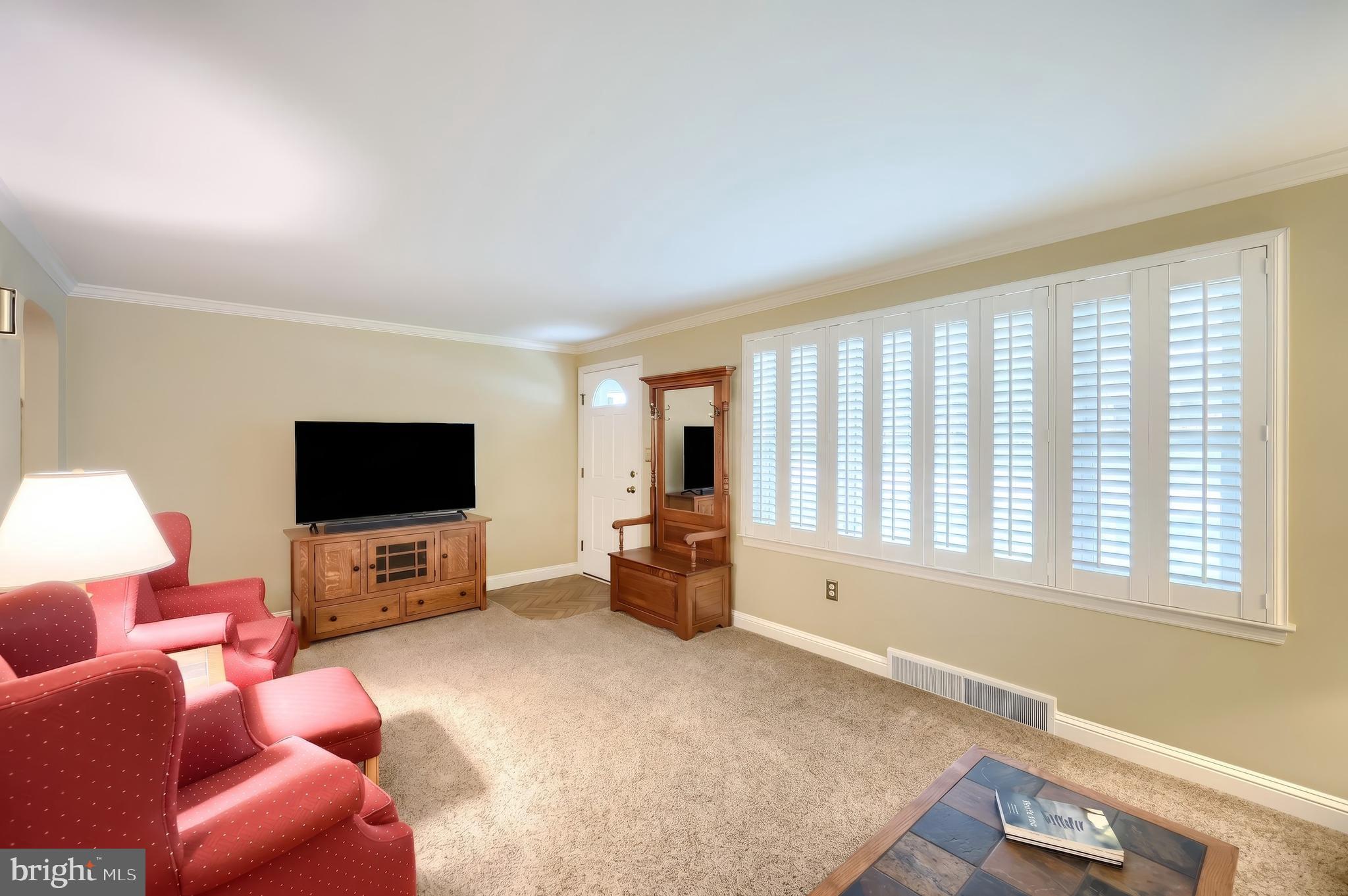 256 North Main Street Manchester, PA 17345 - Photo 7 of 38 a living room with furniture and a flat screen tv