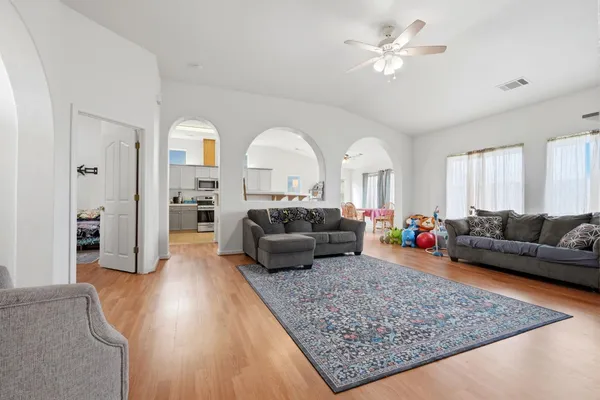 a living room with furniture and a large window