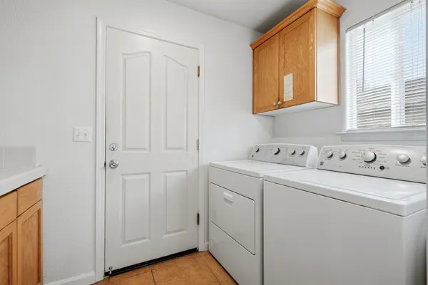 a utility room with dryer and washer