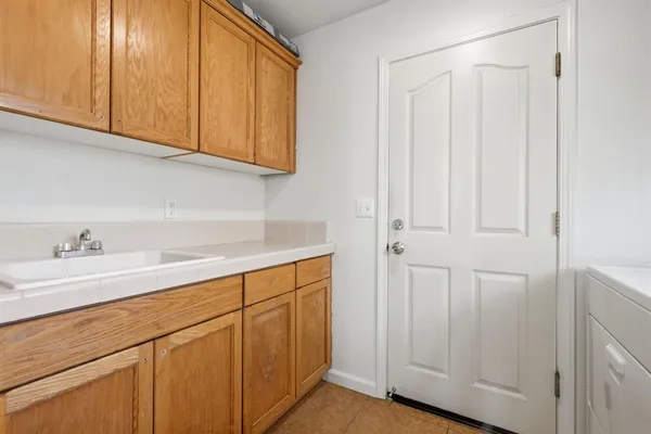 a kitchen with a sink and cabinets