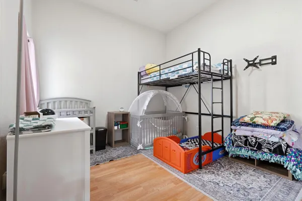 a bedroom with a bed and a couch