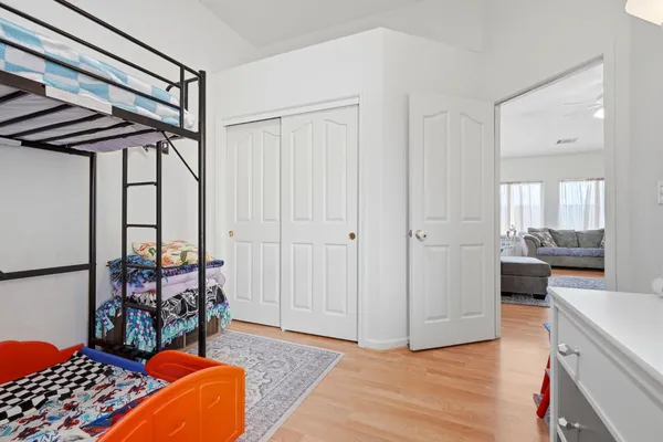a bedroom with furniture and a window