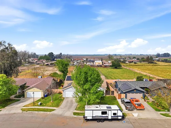 an aerial view of residential houses with outdoor space