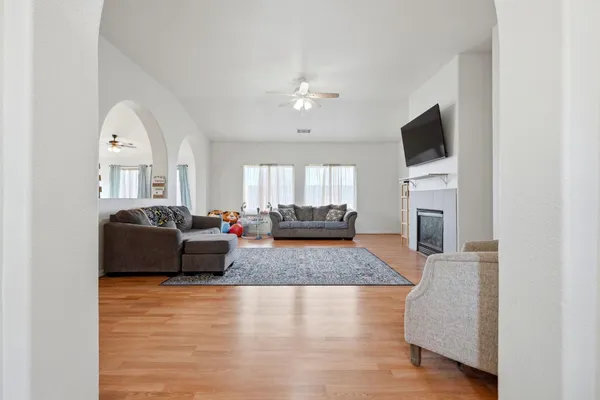 a living room with furniture and a flat screen tv
