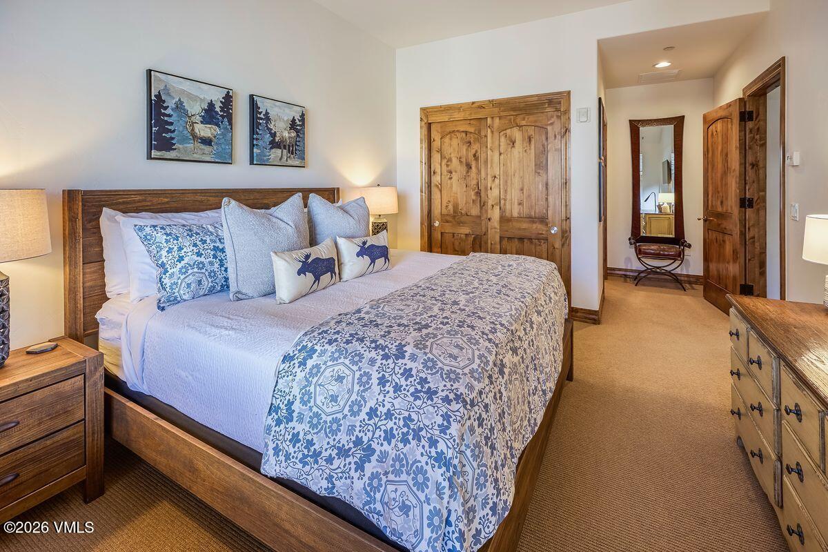 300 Prater Road, Unit A408 Beaver Creek, CO 81620 - Photo 13 of 31 a bed sitting in a bedroom next to a window