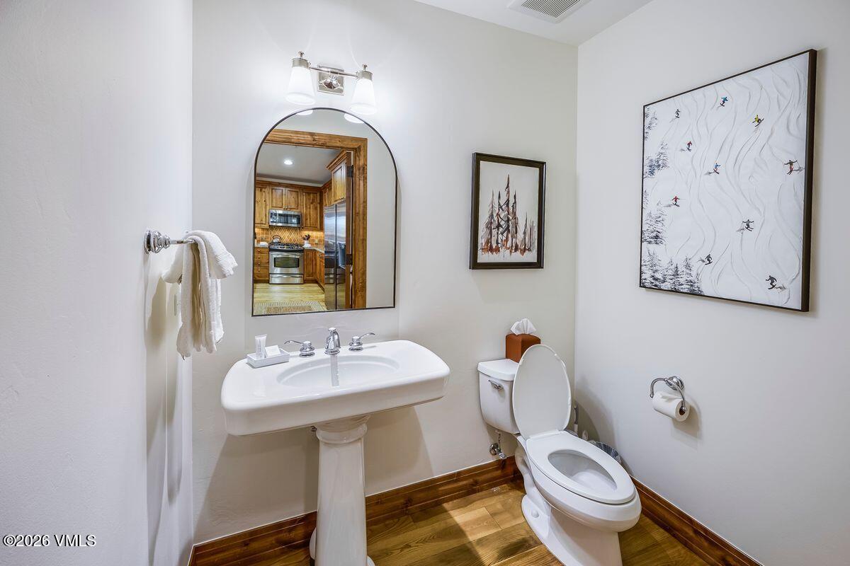 300 Prater Road, Unit A408 Beaver Creek, CO 81620 - Photo 21 of 31 a bathroom with a toilet sink and mirror