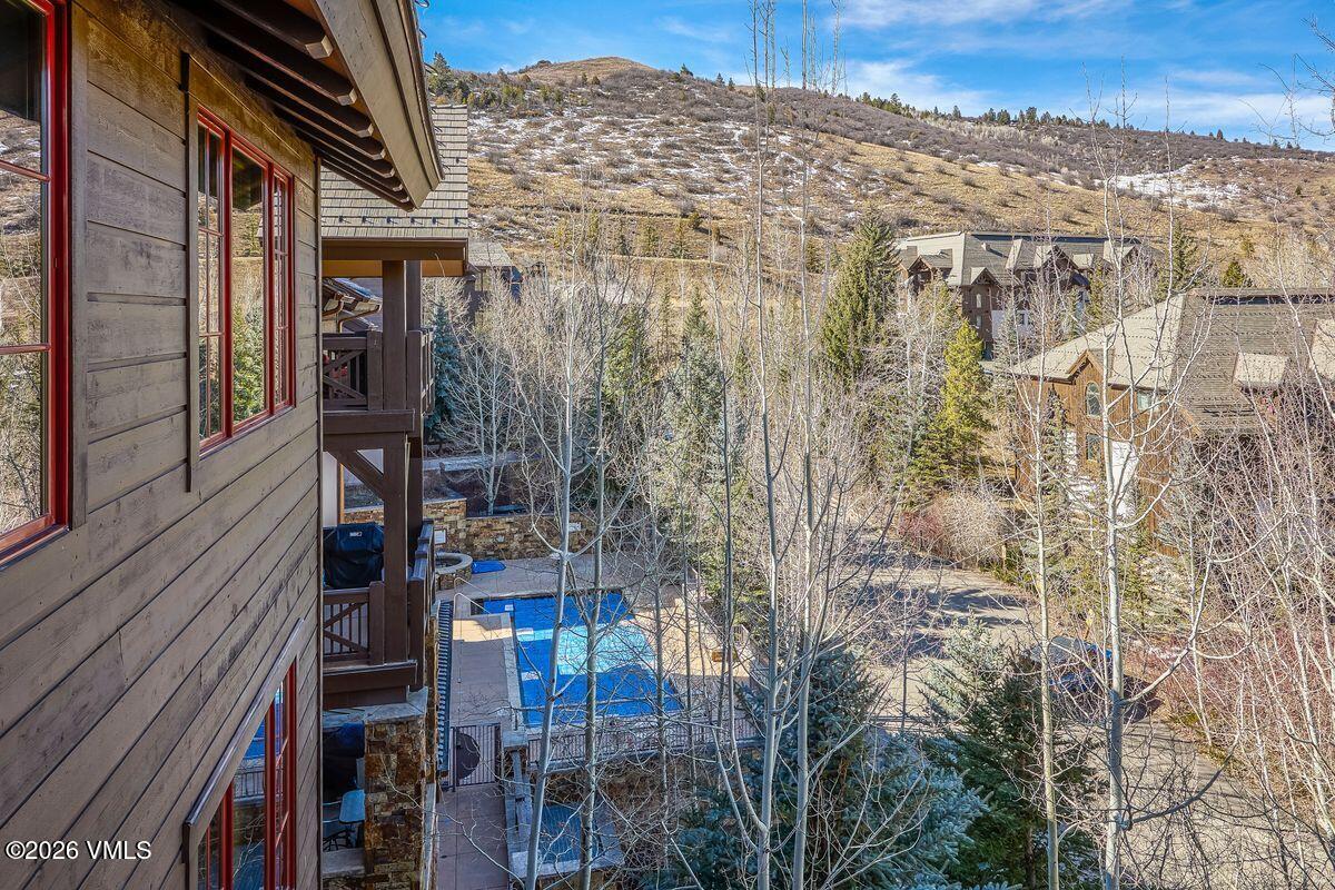 300 Prater Road, Unit A408 Beaver Creek, CO 81620 - Photo 22 of 31 a view of a house with a tree