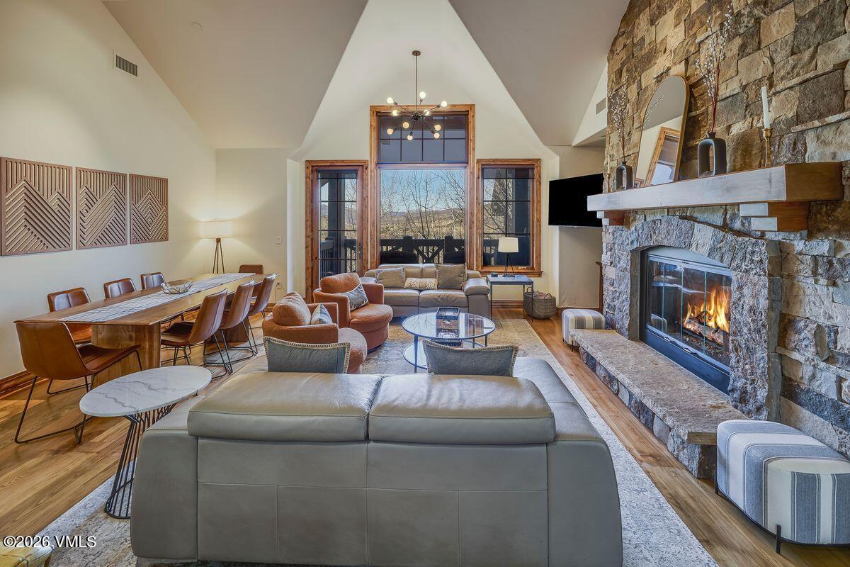 300 Prater Road, Unit A408 Beaver Creek, CO 81620 - Photo 3 of 31 a living room with furniture and a fireplace