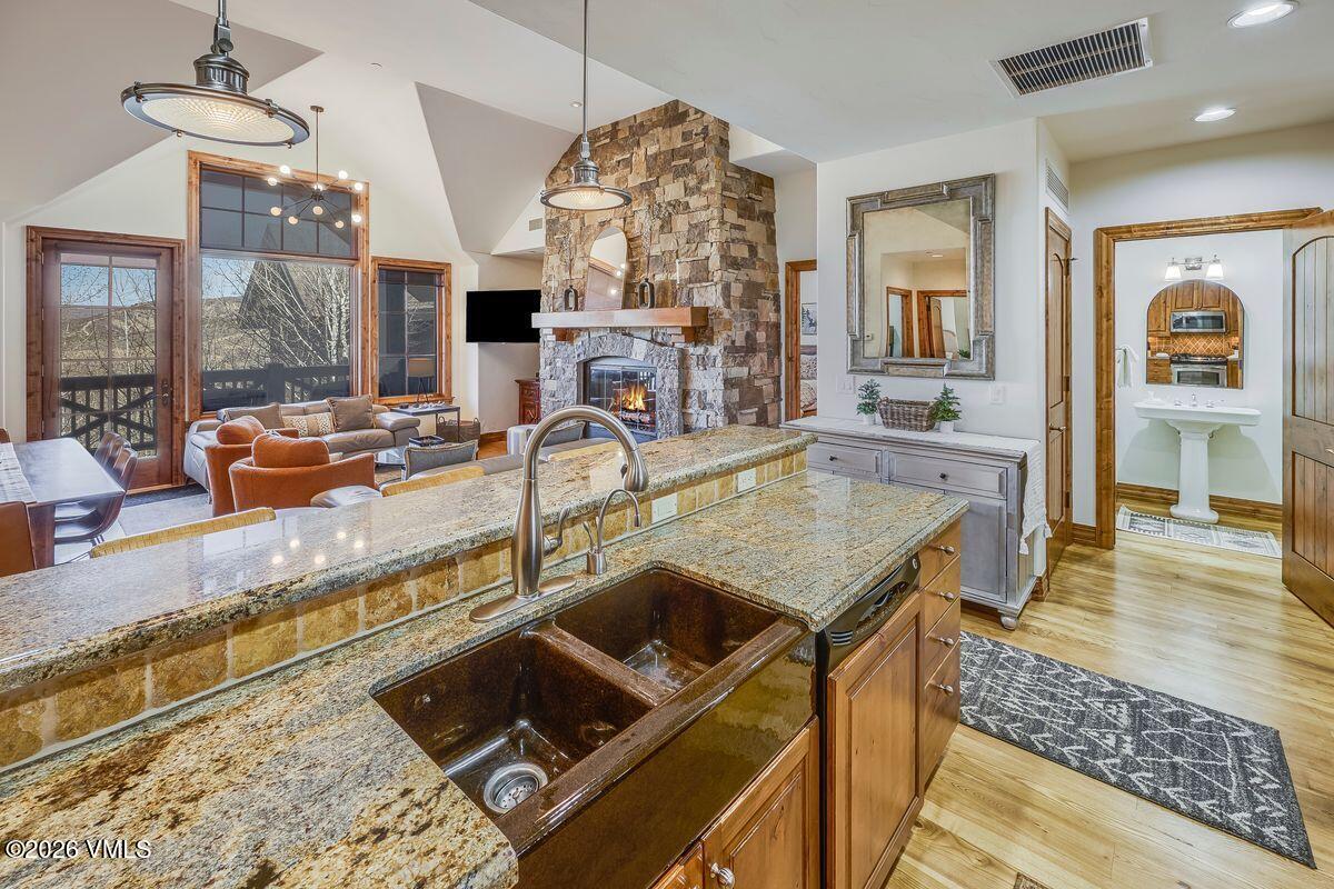 300 Prater Road, Unit A408 Beaver Creek, CO 81620 - Photo 8 of 31 a kitchen with granite countertop a sink and a stove