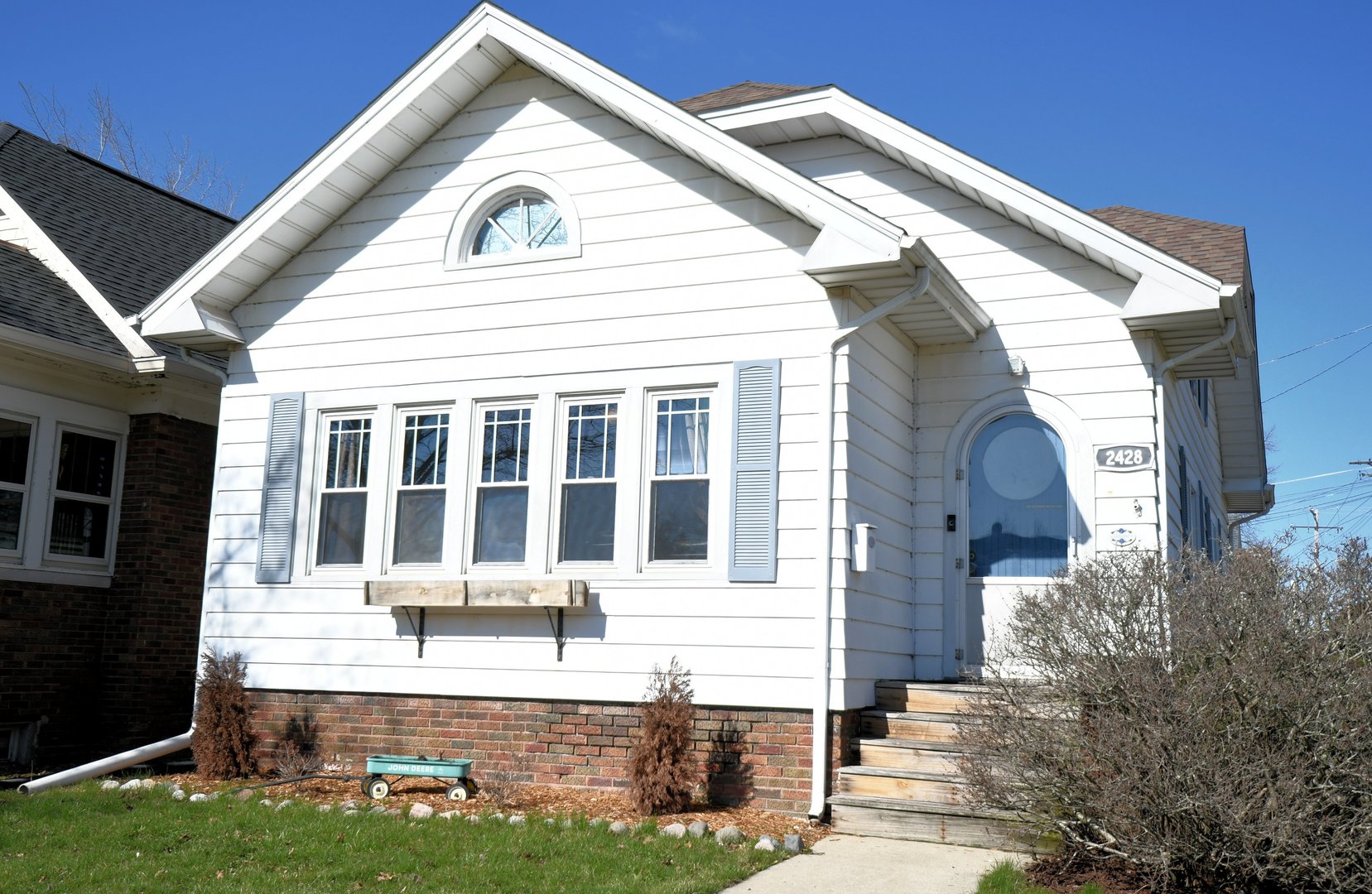 2428 Charles Street Racine, WI 53402 - Photo 32 of 36 a front view of a house with a yard