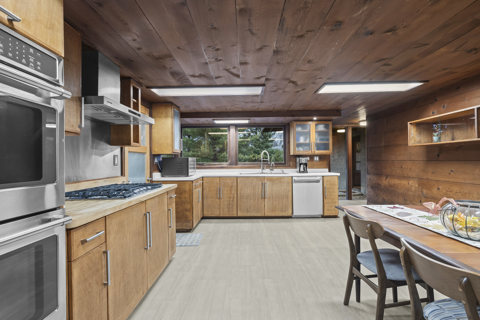 2345 North McAree Road Waukegan, IL 60087 - Photo 18 of 40 a kitchen with stainless steel appliances a stove a sink dishwasher and a refrigerator