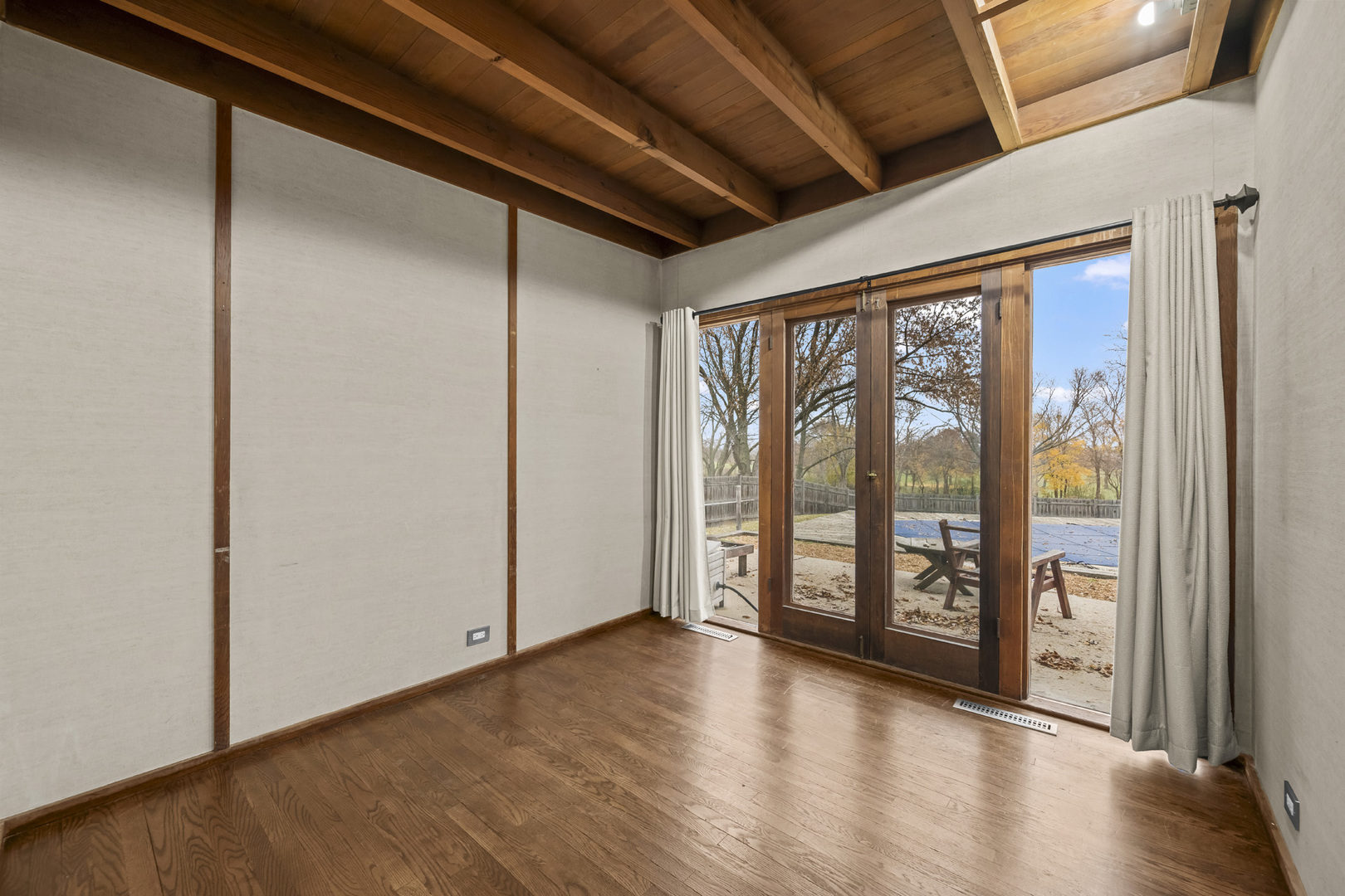 2345 North McAree Road Waukegan, IL 60087 - Photo 23 of 40 a view of an empty room with window and wooden floor