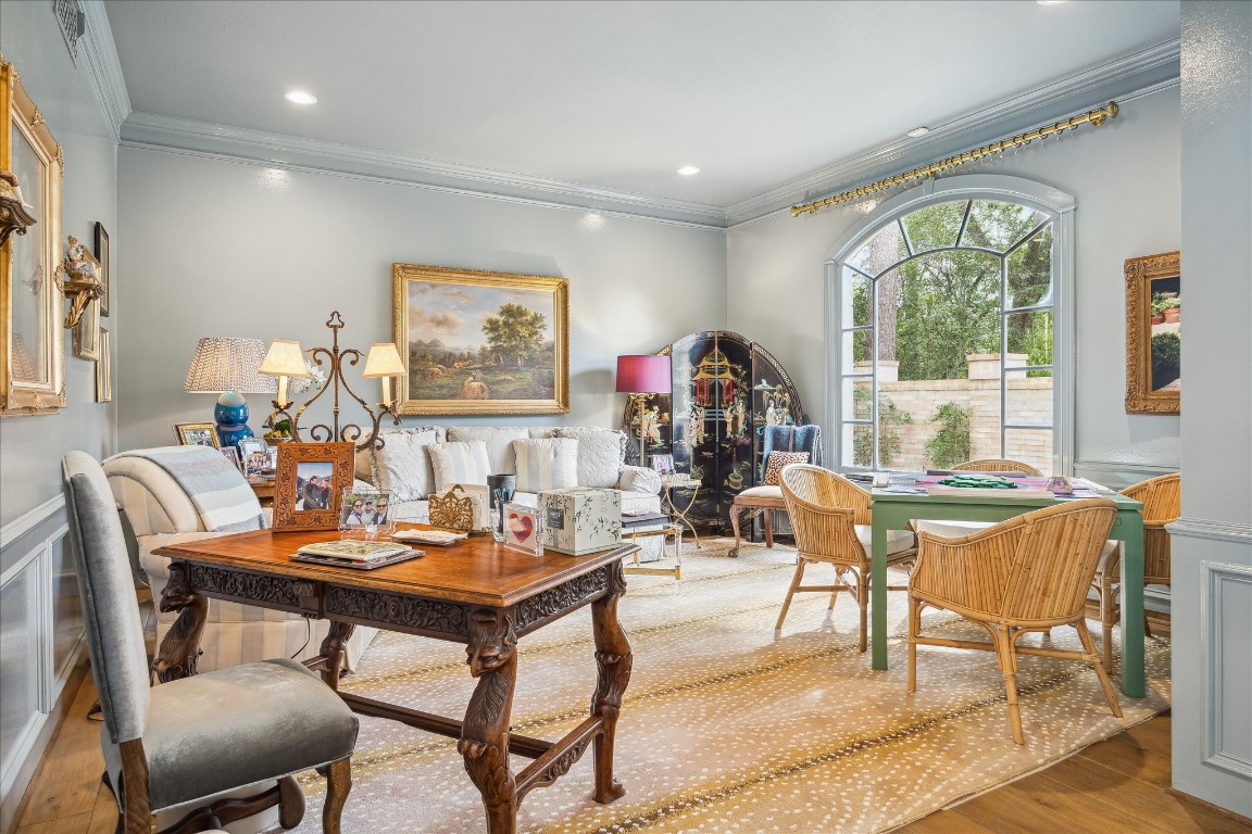 11524 Taylorcrest Road Houston, TX 77024 - Photo 13 of 47 Just off the entry, the block-paneled, blue high gloss front room offers flexible living space ideal for a study or office, formal sitting room, or game room—perfect for a mahjong table—with views through the Palladian window of the front courtyard.