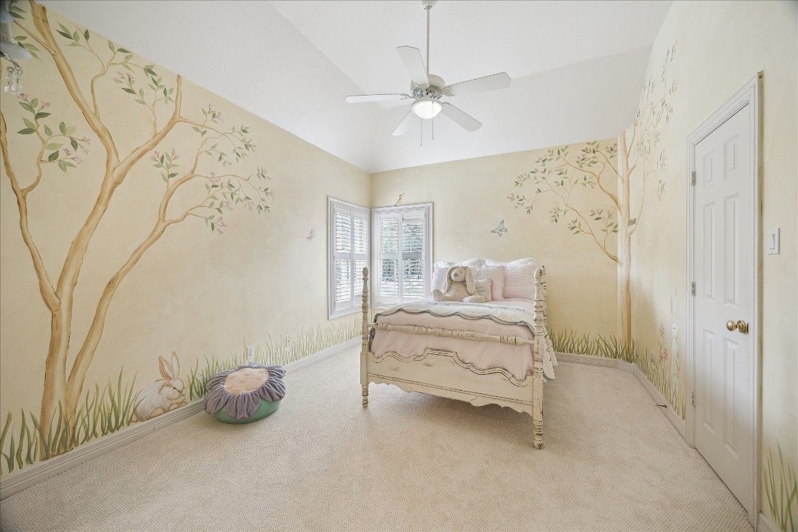 11524 Taylorcrest Road Houston, TX 77024 - Photo 33 of 47 Secondary upstairs bedroom featuring a custom painted mural, new carpet, windows with plantation shutters, high ceilings, a walk-in closet, and an adjoining Hollywood bathroom.