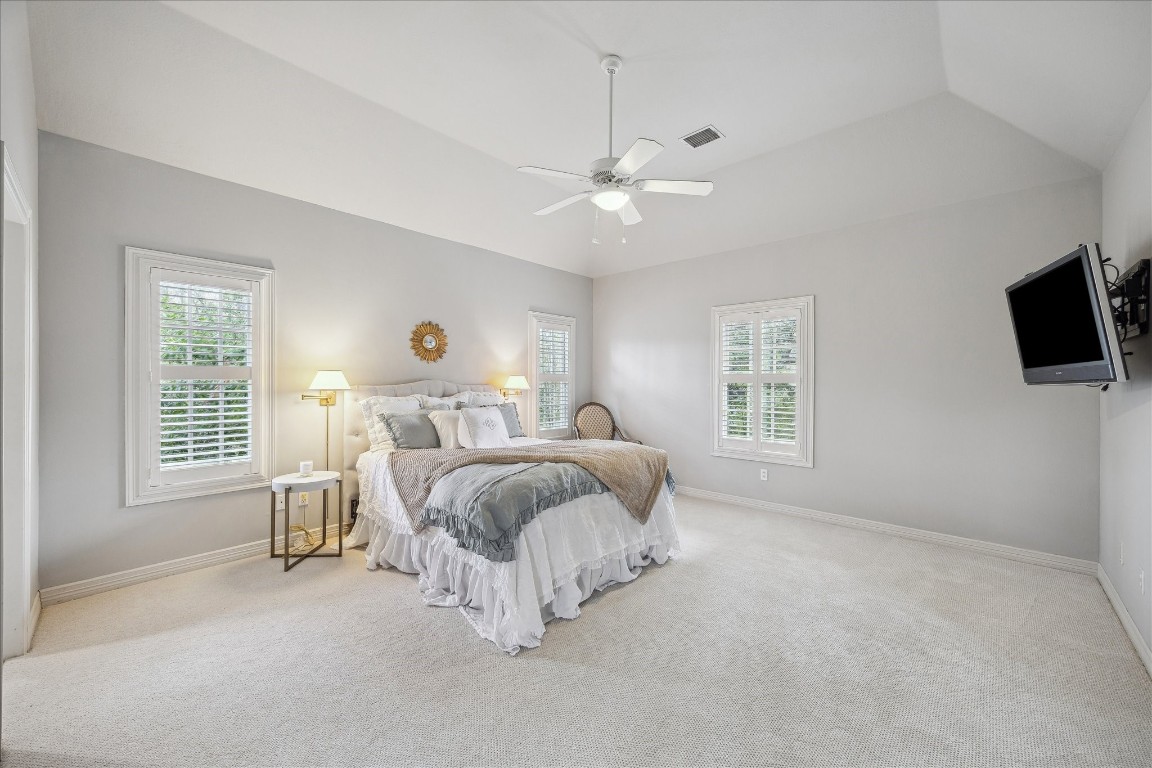 11524 Taylorcrest Road Houston, TX 77024 - Photo 37 of 47 The spacious third upstairs bedroom overlooks the front yard and features plantation shutters, a built-in desk, new carpet, high ceilings, a walk-in closet, and an adjoining bathroom.