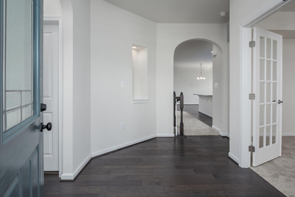 1042 Oglethorpe Drive Franklin, TN 37064 - Photo 26 of 30 an empty room with wooden floor and a hallway