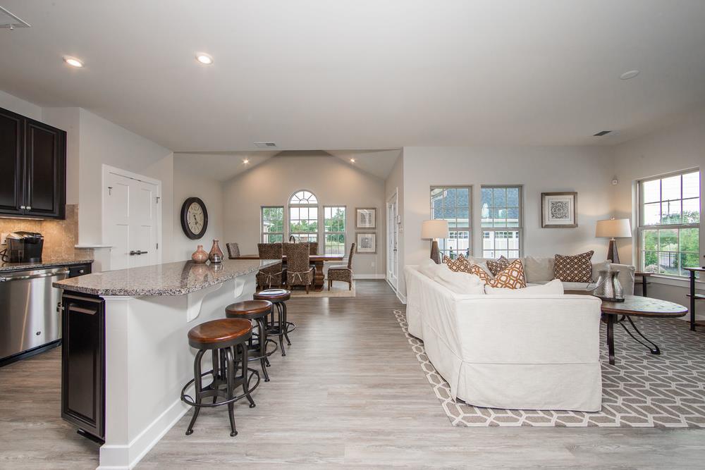 1042 Oglethorpe Drive Franklin, TN 37064 - Photo 7 of 30 a living room with fireplace furniture and a wooden floor