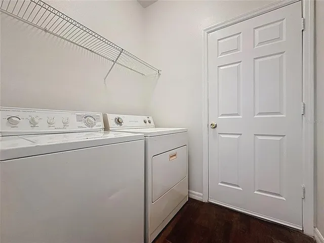 a view of an empty room with a staircase