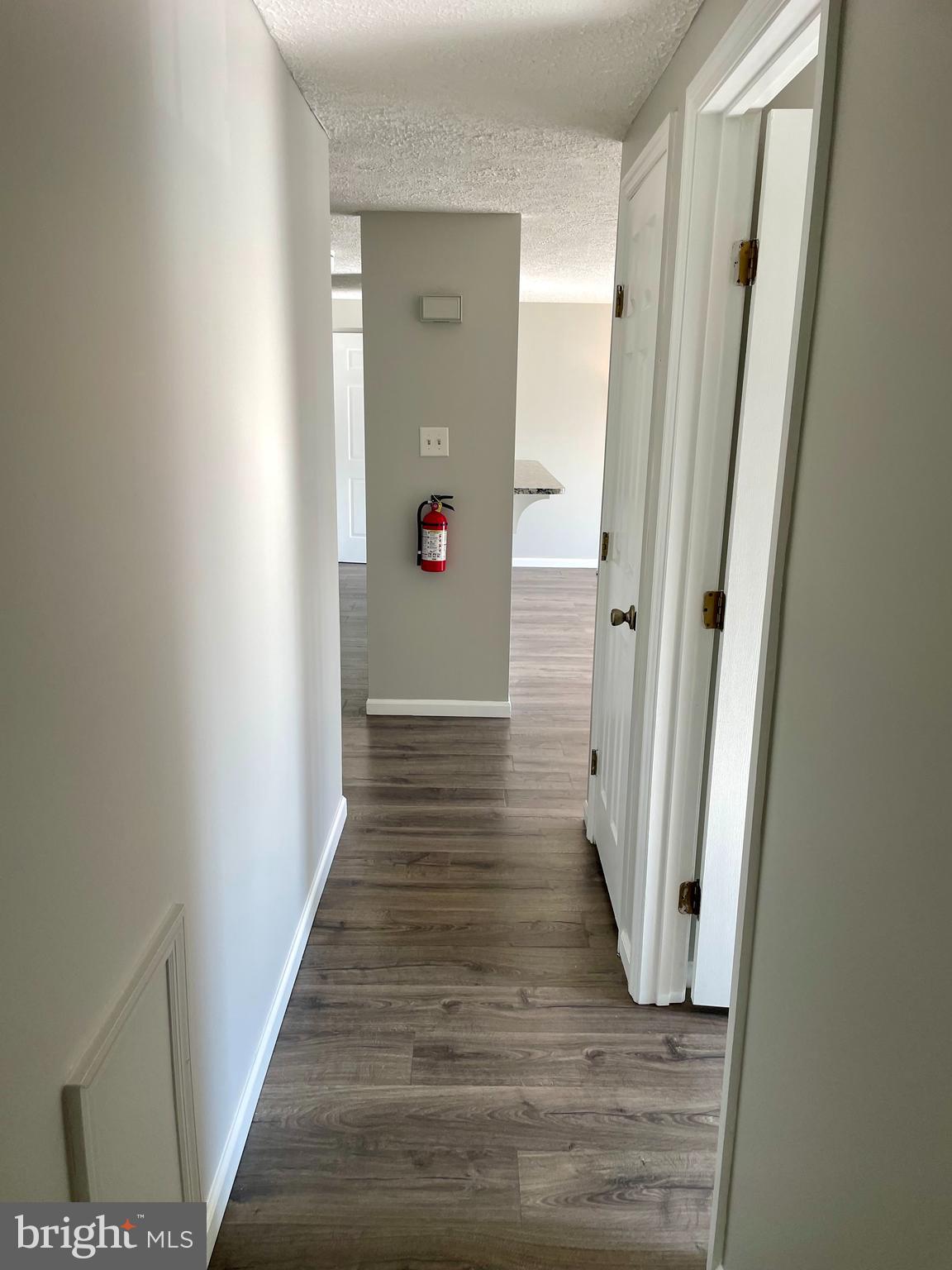 17 Cranberry Court Marlton, NJ 08053 - Photo 17 of 17 a view of a hallway with wooden floor
