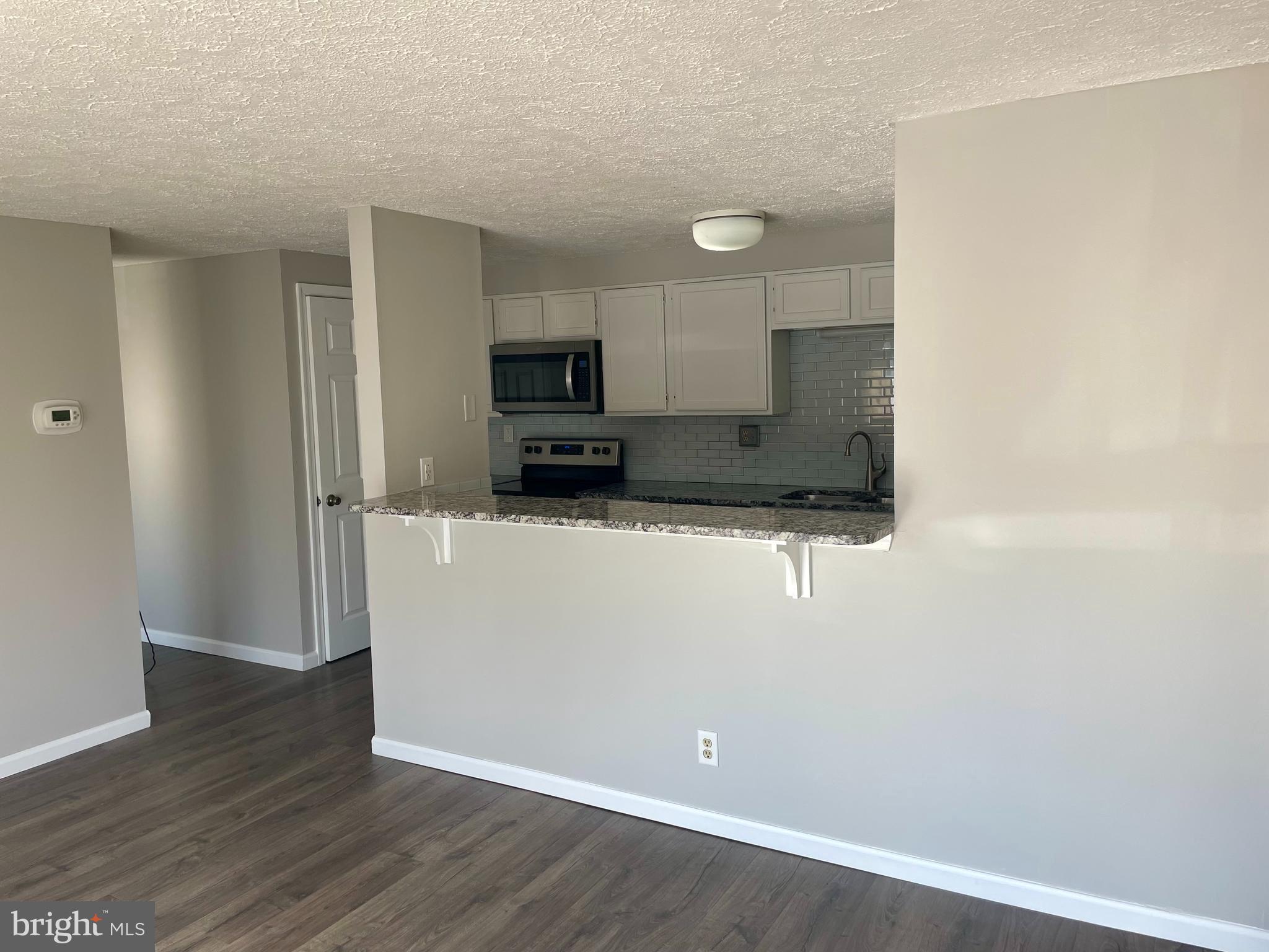 17 Cranberry Court Marlton, NJ 08053 - Photo 6 of 17 a view of a kitchen with a sink and a refrigerator
