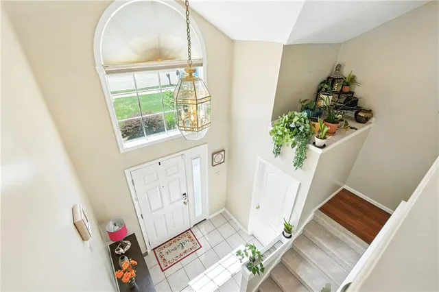 an entryway with wooden floor