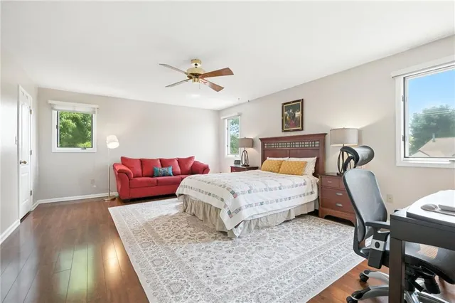 a bedroom with a large bed and a couch