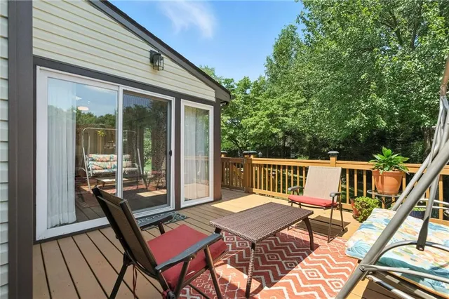 a view of a patio with wooden floor