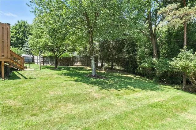 a backyard of a house with lots of green space