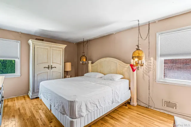 a bedroom with bed and window