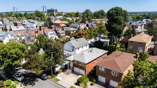 an aerial view of multiple houses with yard