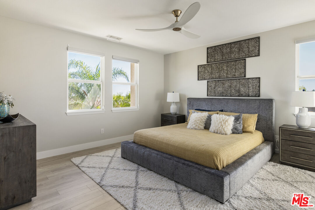 11540 Apulia Court Porter Ranch, CA 91326 - Photo 13 of 25 a bedroom with a bed and a window