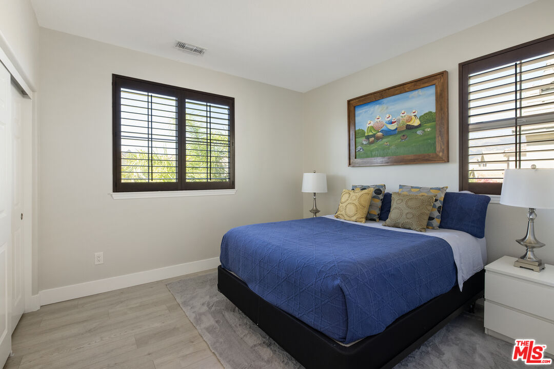 11540 Apulia Court Porter Ranch, CA 91326 - Photo 20 of 25 a bedroom with a bed and a window