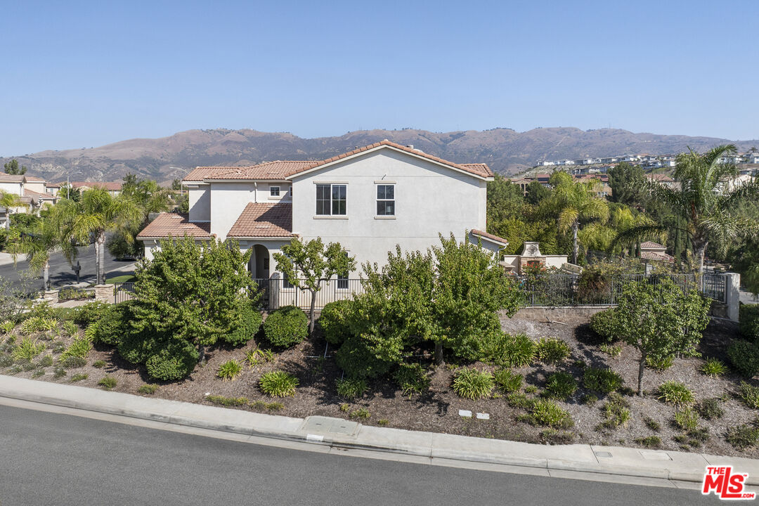 11540 Apulia Court Porter Ranch, CA 91326 - Photo 22 of 25 an aerial view of a house with a yard and balcony