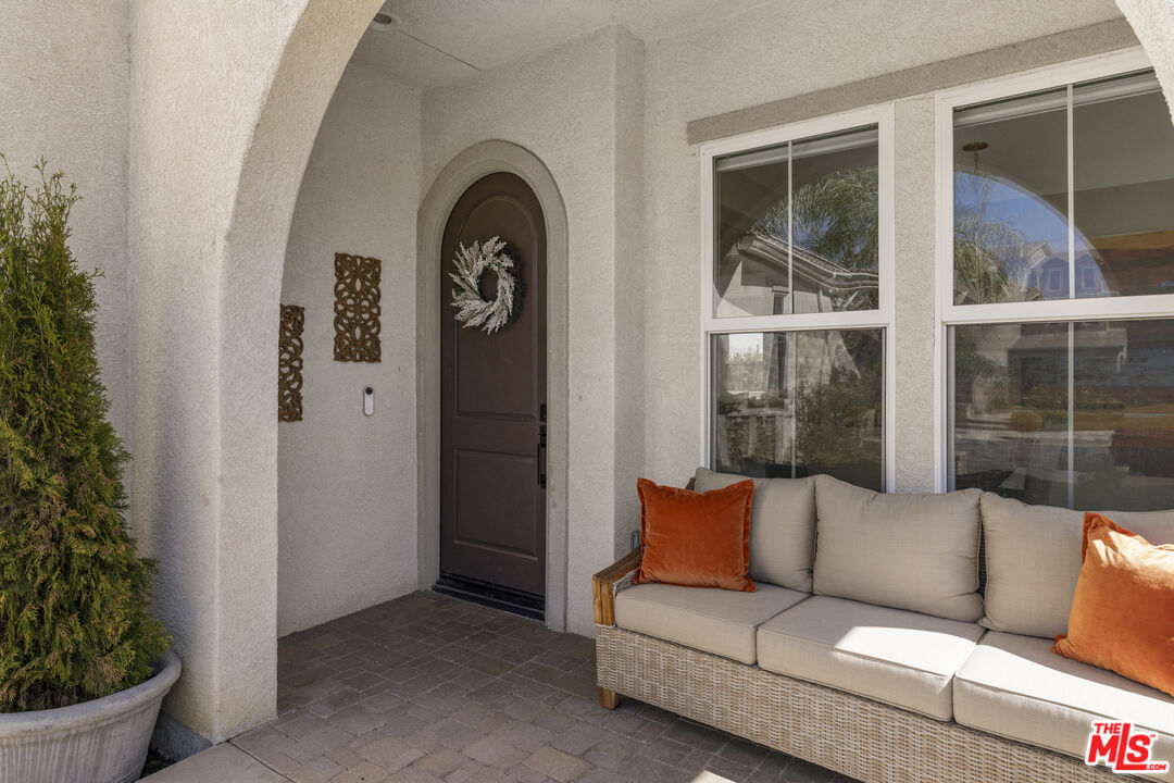 11540 Apulia Court Porter Ranch, CA 91326 - Photo 3 of 25 a living room with furniture and a potted plant