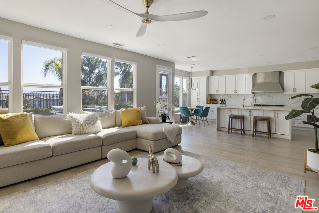 11540 Apulia Court Porter Ranch, CA 91326 - Photo 10 of 25 a living room with furniture and a large window