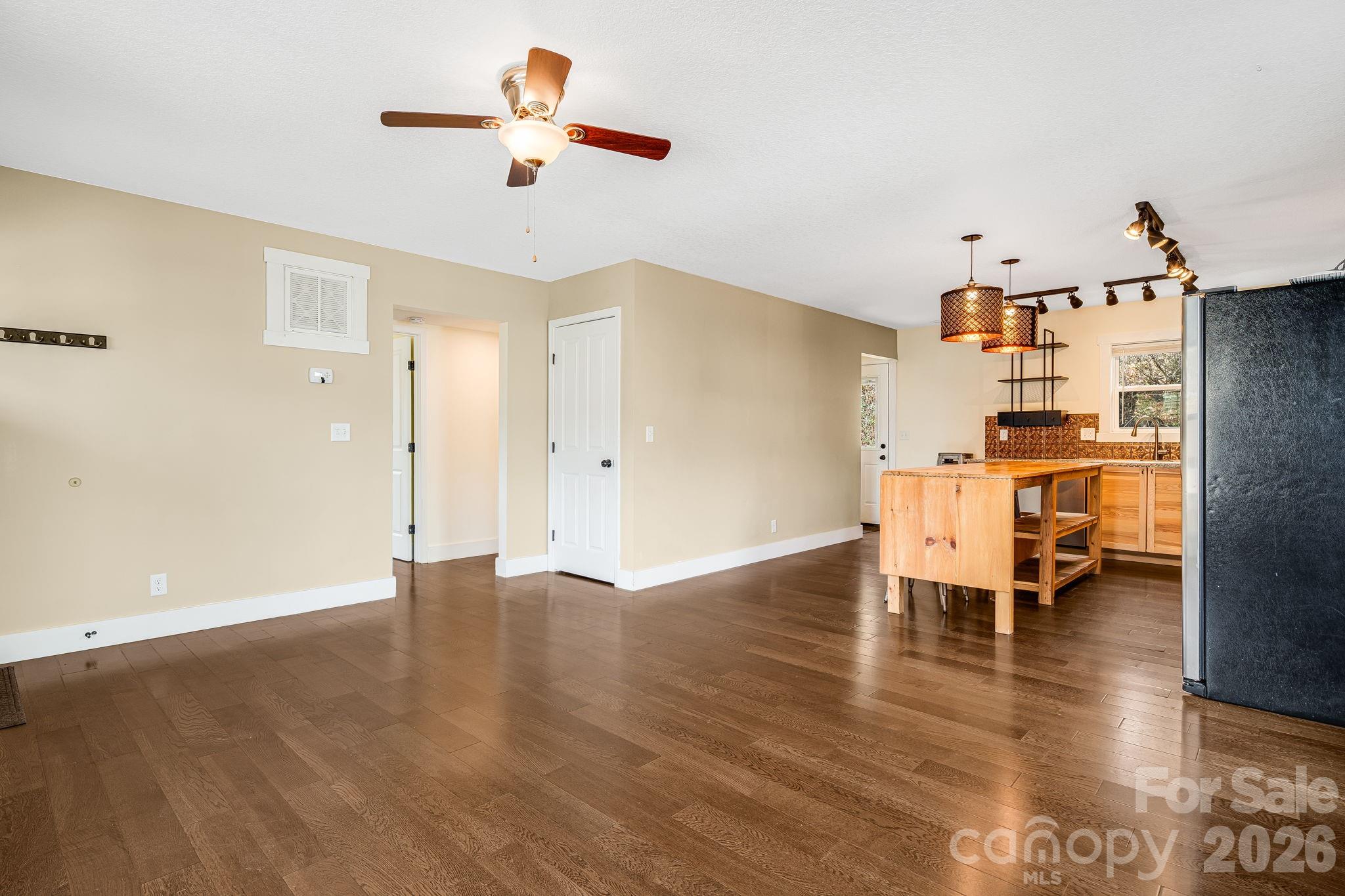 309 London Road Asheville, NC 28803 - Photo 11 of 41 a view of a livingroom with furniture and a ceiling fan