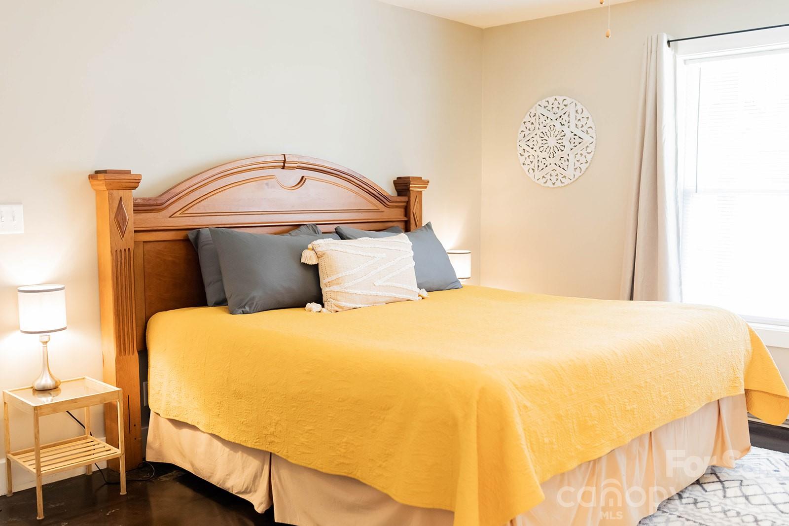 309 London Road Asheville, NC 28803 - Photo 21 of 41 a bedroom with a bed and wooden floor