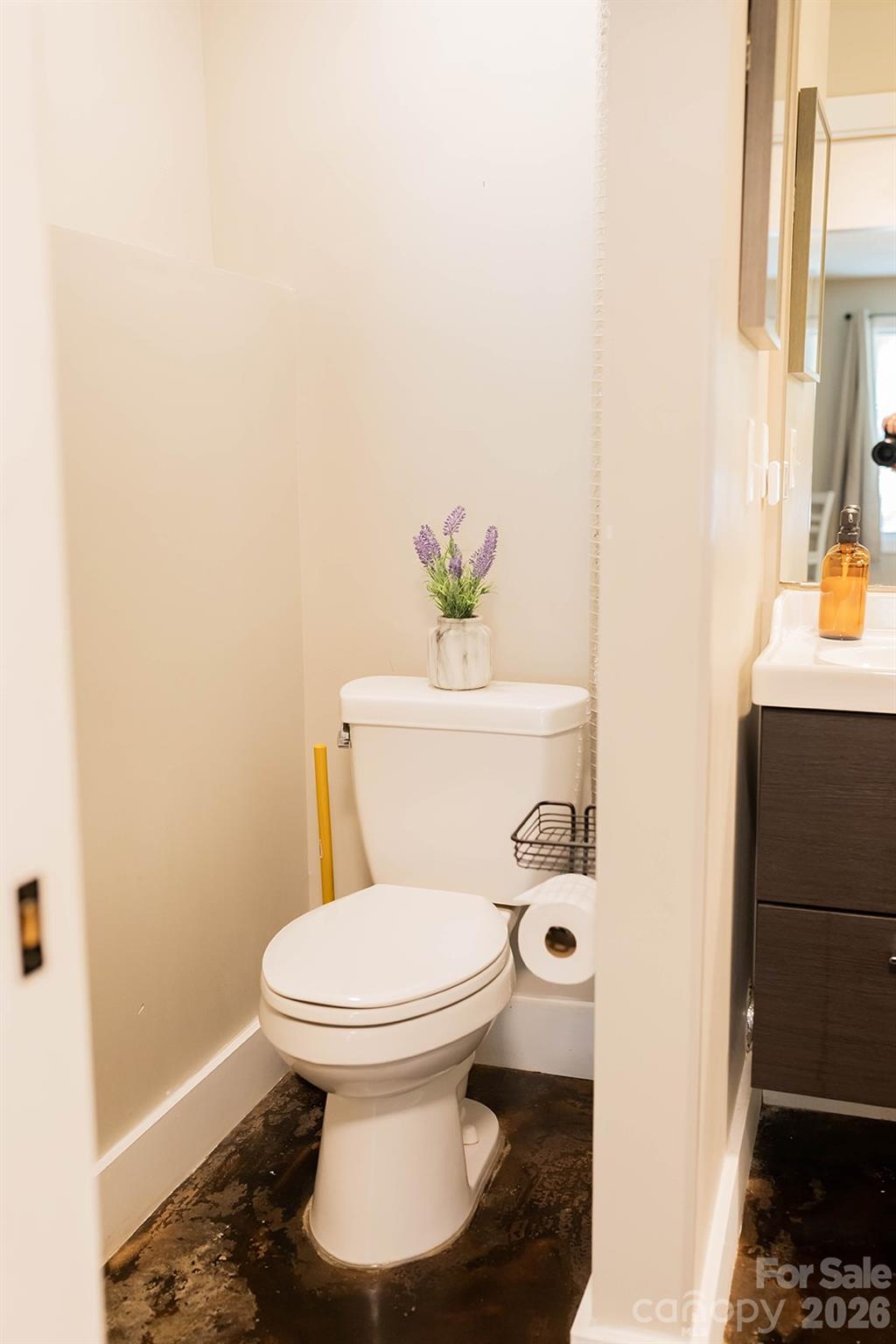 309 London Road Asheville, NC 28803 - Photo 26 of 41 a white toilet sitting next to a bathroom sink