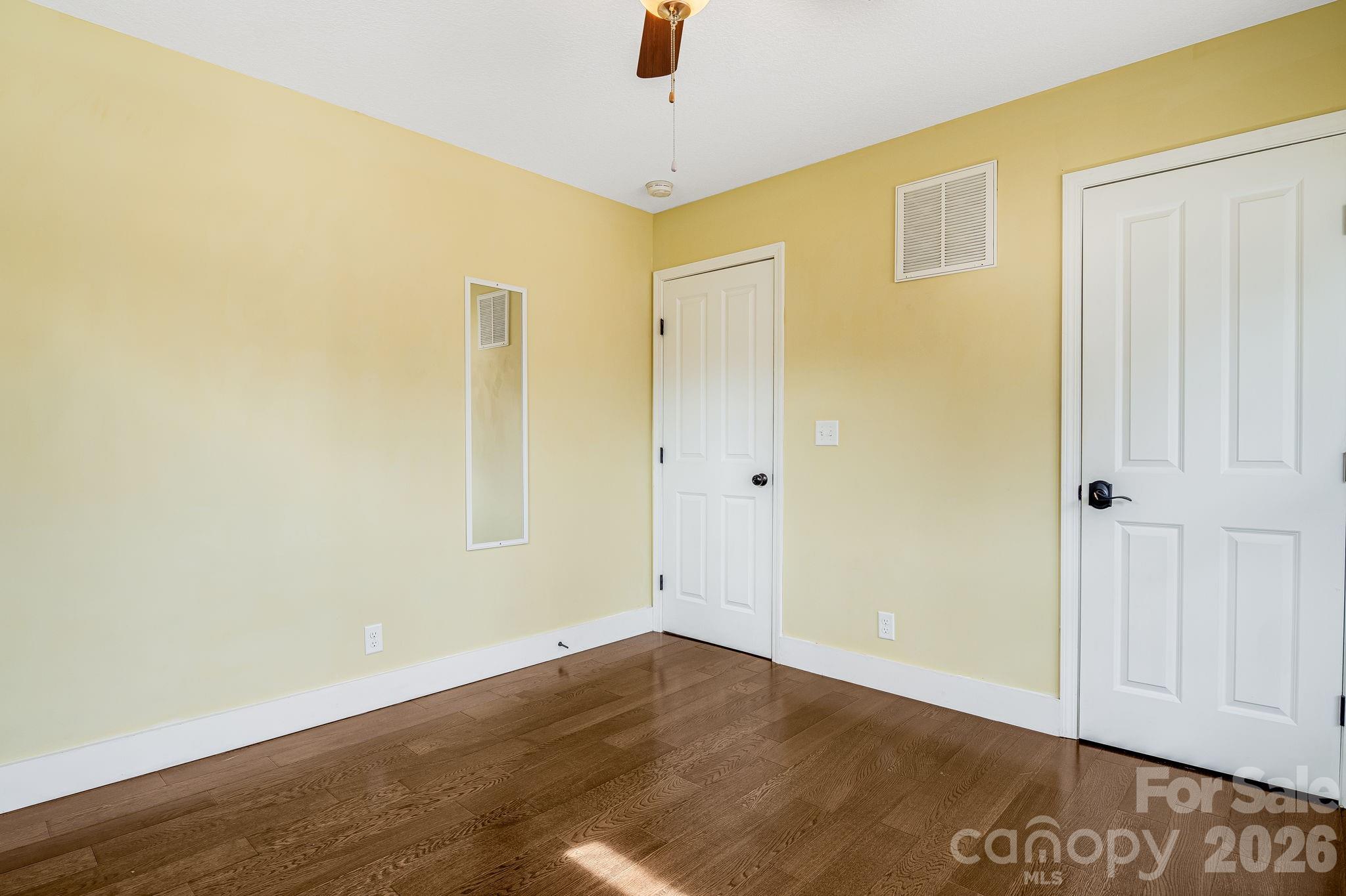 309 London Road Asheville, NC 28803 - Photo 28 of 41 an empty room with wooden floor and windows