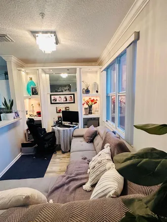a living room with furniture and a window