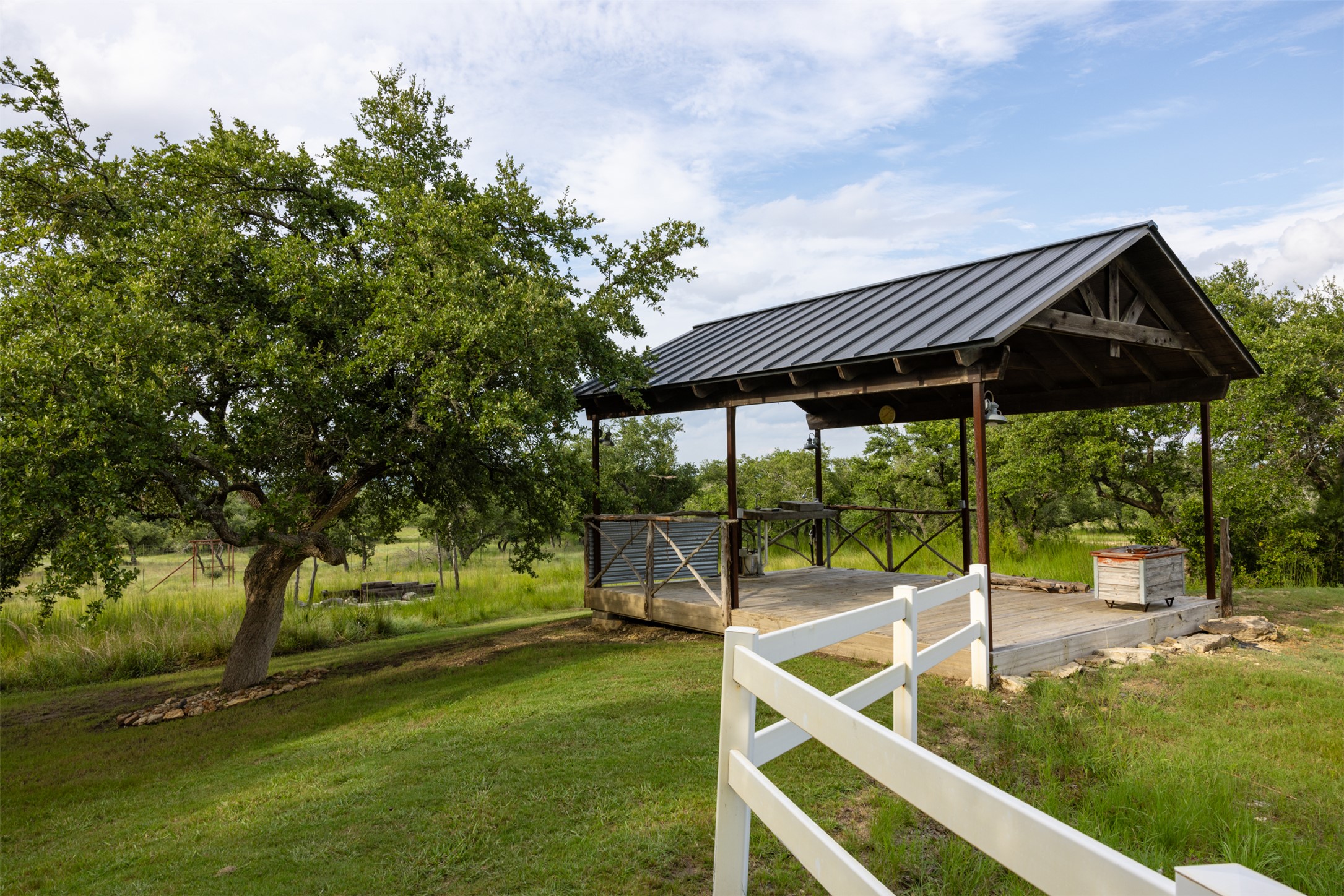 3149 Byrd Ranch Road Johnson City, TX 78636 - Photo 21 of 39 View of grassy yard featuring view of wooded area