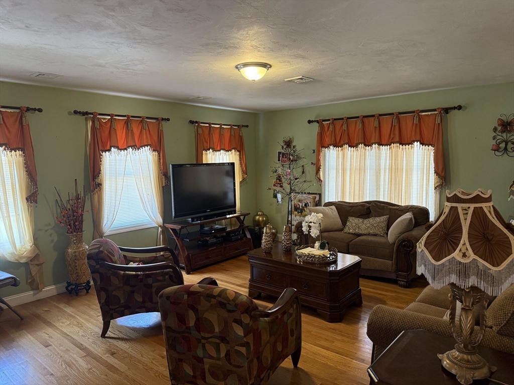 20 Massasoit Street Boston, MA 02136 - Photo 5 of 18 a living room with furniture and a flat screen tv