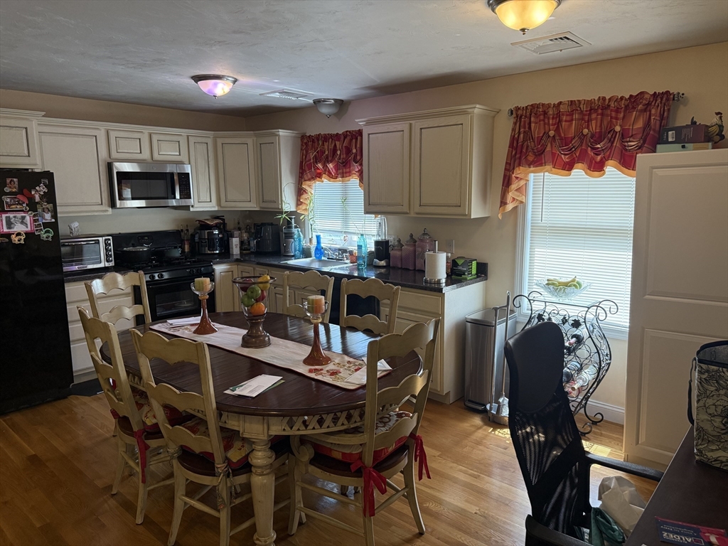 20 Massasoit Street Boston, MA 02136 - Photo 6 of 18 a view of a dining room with furniture and wooden floor