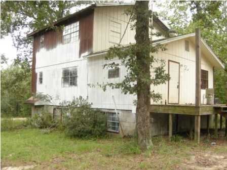 4858 Hinote Road DeFuniak Springs, FL 32433 - Photo 20 of 27 a front view of a house with garden