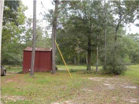 4858 Hinote Road DeFuniak Springs, FL 32433 - Photo 21 of 27 a view of a backyard