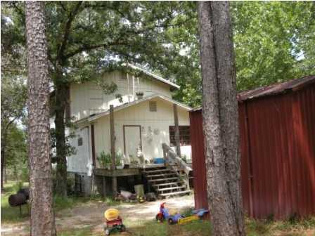 4858 Hinote Road DeFuniak Springs, FL 32433 - Photo 6 of 27 a front view of a house with a yard